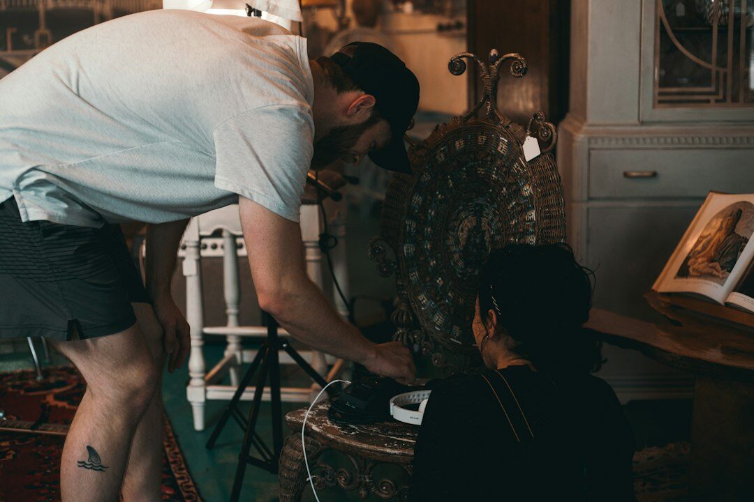 Diverse film crew setting up equipment on a production set