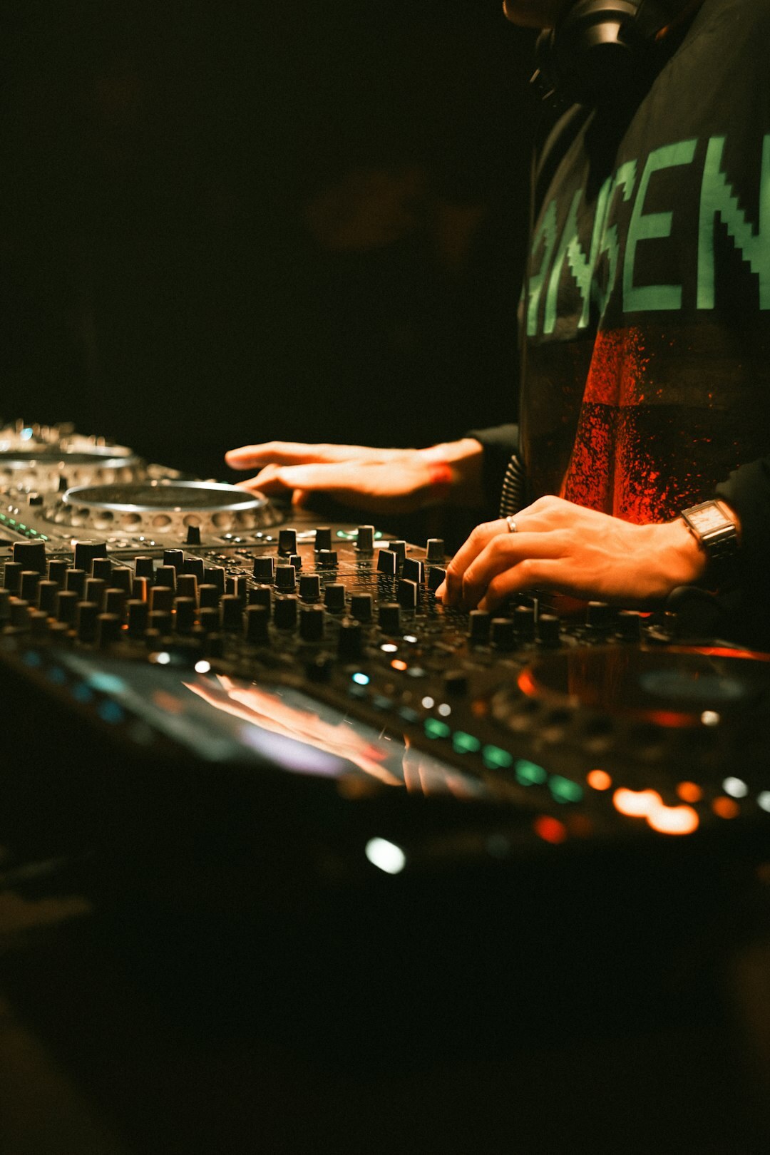 Audio engineer operating a sound mixing console